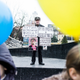 A protestor during Unity Day celebrations with posters blaming everything on Hitler, Putin, and the Jews.